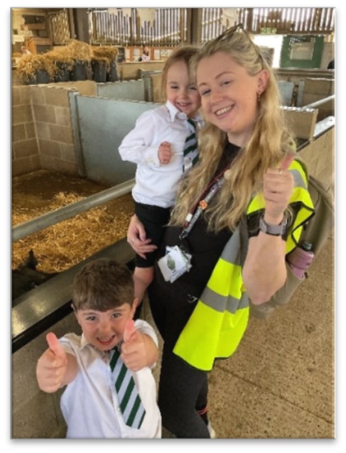 Miss Foster and children looking at animals
