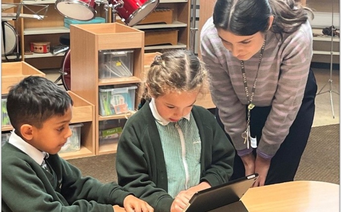 Children using an iPad to create a cartoon